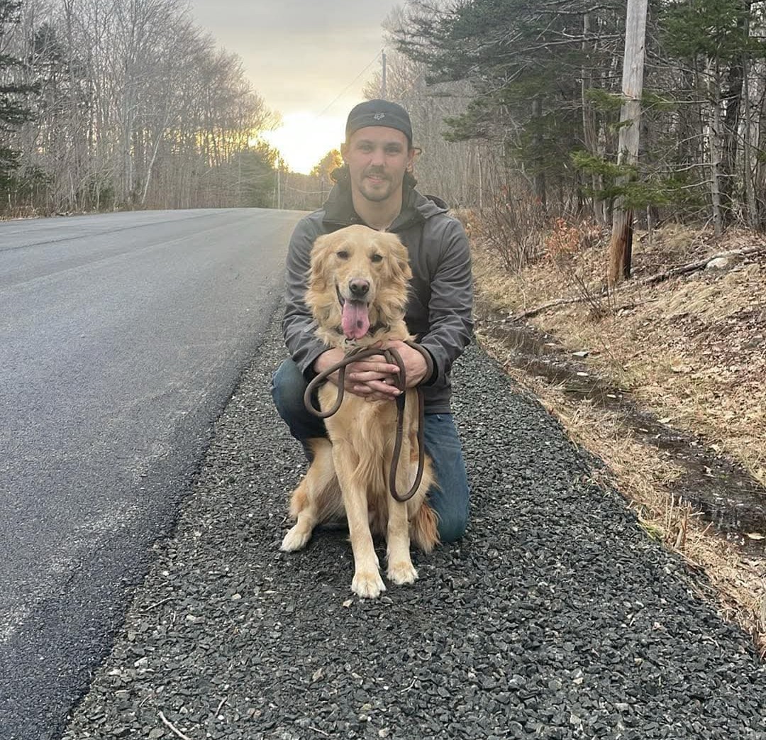 Brandon with his dog in Nova Scotia