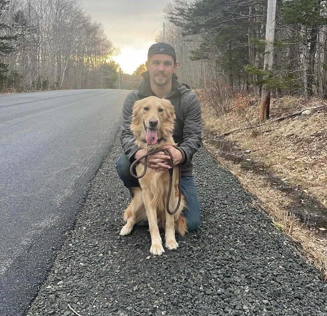 Brandon with his dog in Nova Scotia